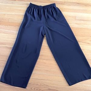 Size 14 black palazzo pants. Dress them up with a blouse or knit for evening.